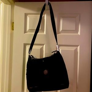 Black bag with a leopard print on it great bag for traveling or just around town